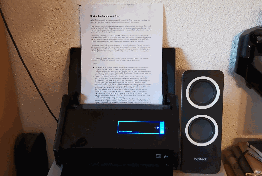 ScanSnap scanner scanning four pages in roughly 5 seconds.